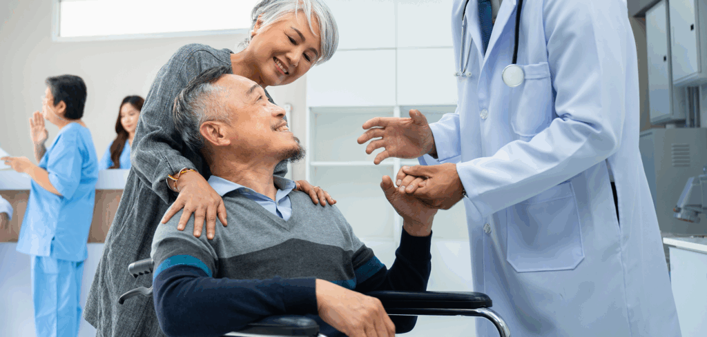 Smiling senior Asian male patient leaving the hospital