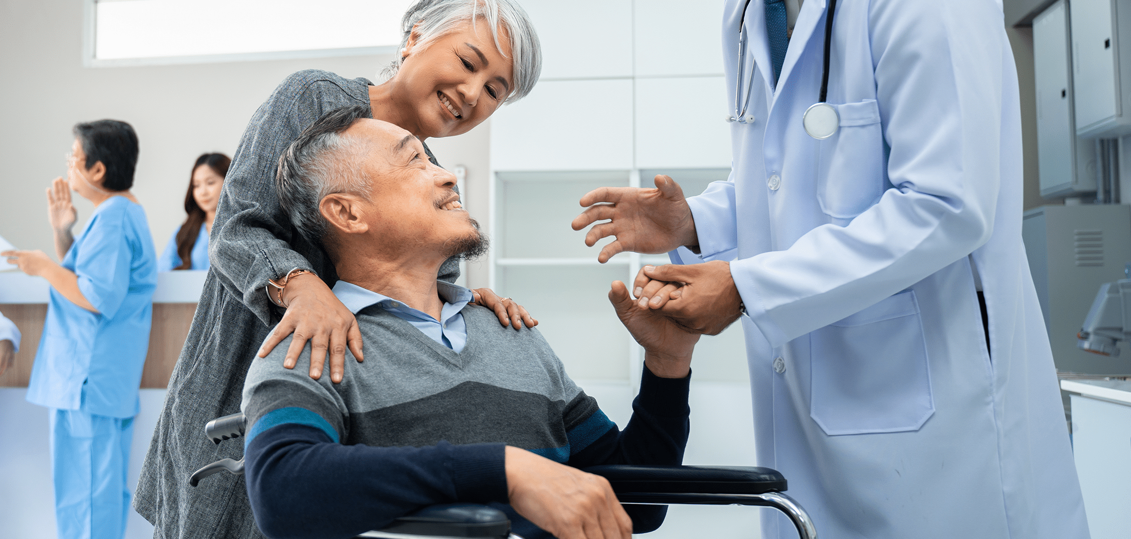 Smiling senior Asian male patient leaving the hospital