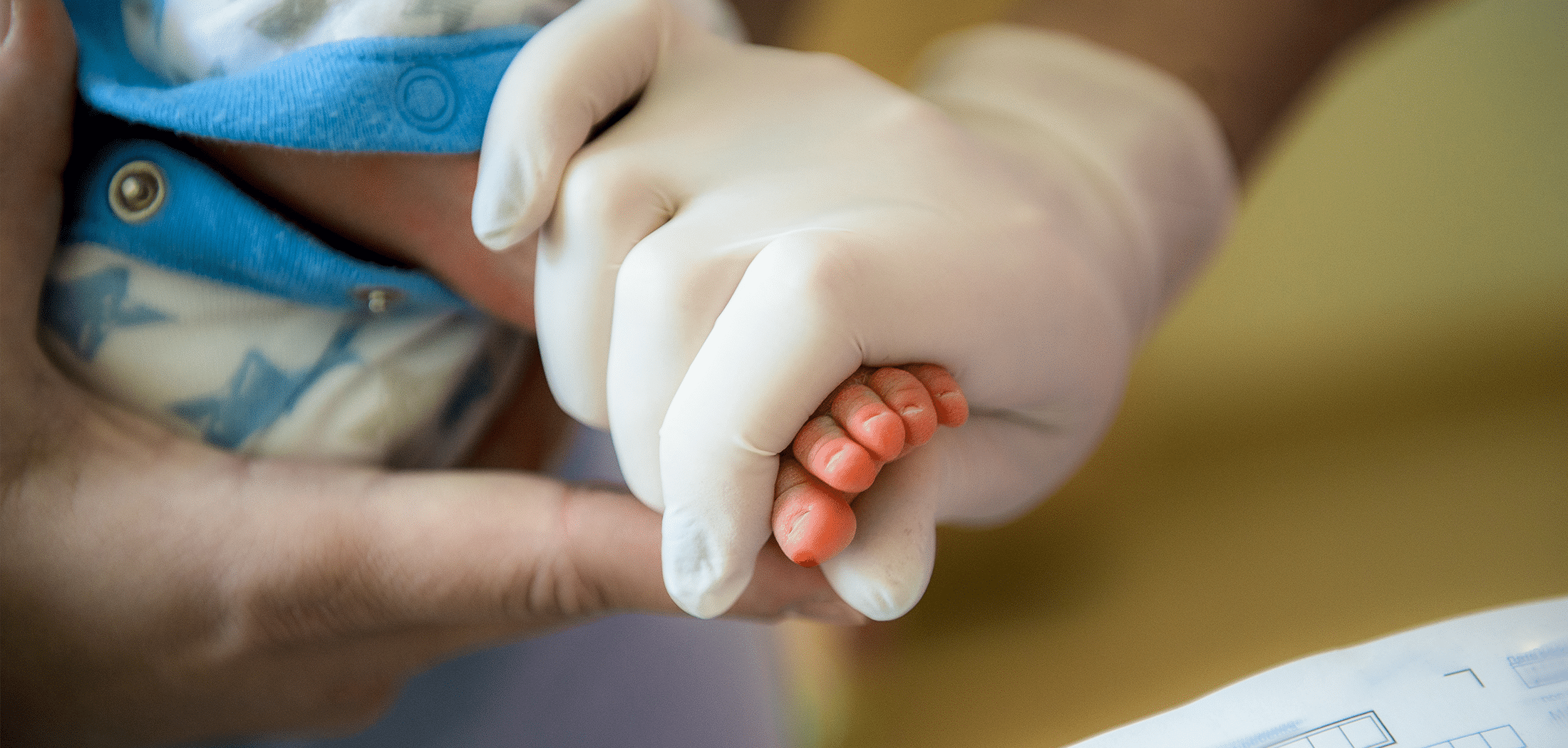 Doctor takes a blood test in newborns