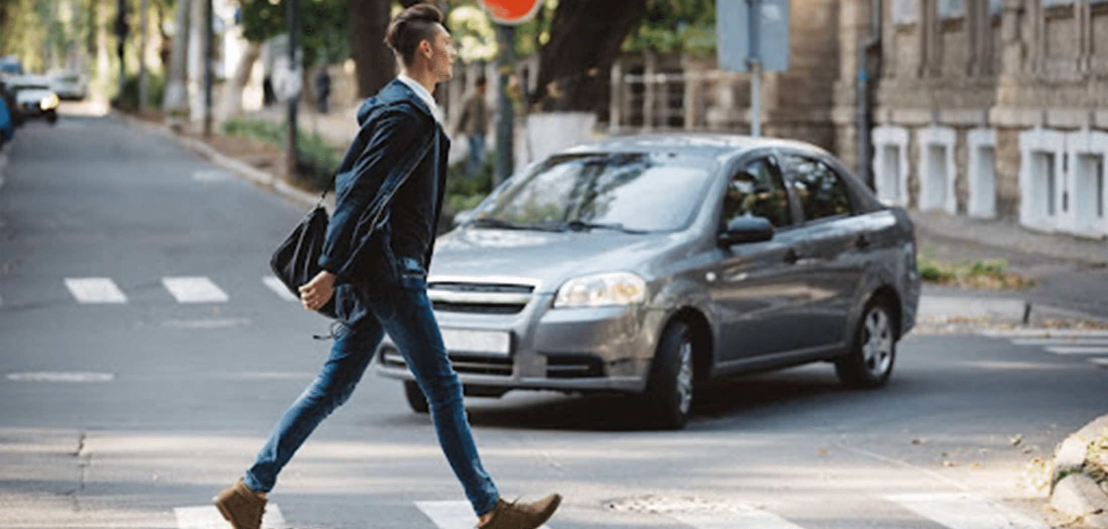 Pedestrian crossing with incoming vehicle